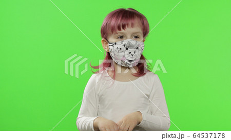 Little girl in medical face mask. Isolation. World pandemic COVID-19 coronavirus Little girl in medical face mask. Isolation. World pandemic COVID-19 coronavirus 64537178