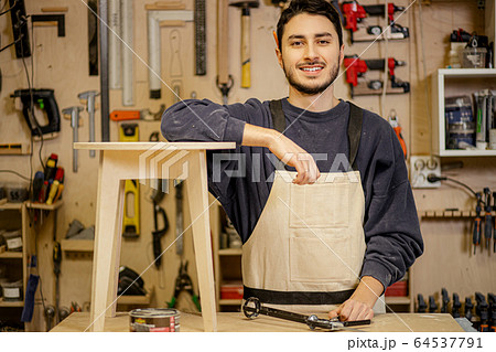 caucasian furniture maker with handmade wooden chair 64537791