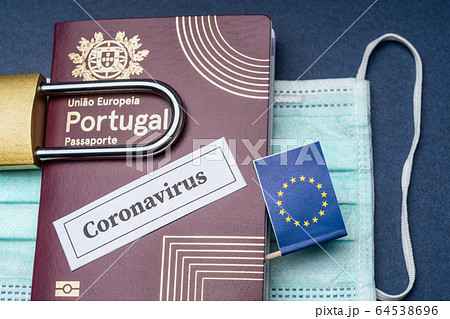 Portuguese European travel passport with padlock and mask on a blue background. 64538696