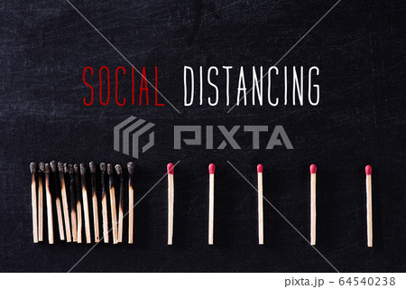 Social Distancing concept. Matchsticks burn, one 64540238