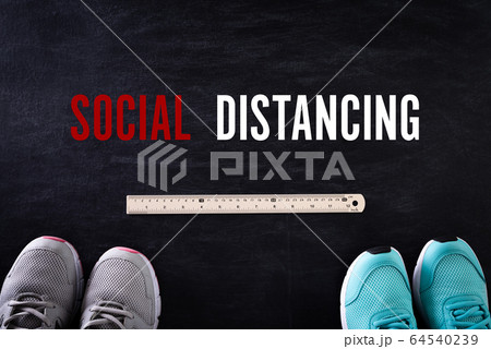 Social Distancing concept. shoes with ruler on Social Distancing concept. shoes with ruler on 64540239