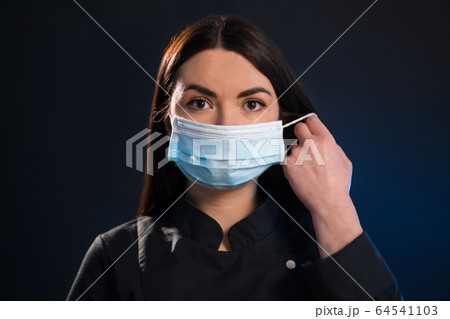 Beautiful girl on a black and blue background 64541103