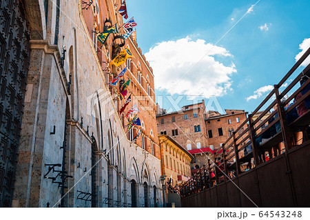 Palazzo Pubblico at Campo square in Siena, Italy 64543248