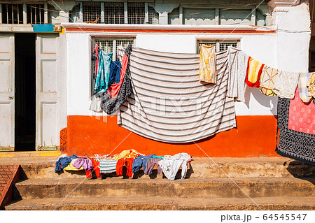 Old house and hanging laundry in Mysore, India Old house and hanging laundry in Mysore, India 64545547
