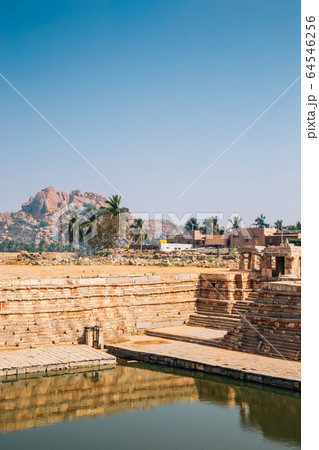 Manmatha Tank and exotic rocky mountain in Hampi, India 64546256