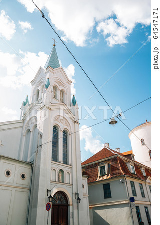 Our Lady of Sorrows Church and old town street in Riga, Latvia 64547171