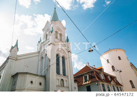 Our Lady of Sorrows Church and old town street in Riga, Latvia 64547172