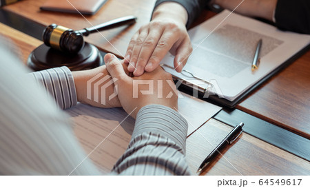 Lawyer working with client discussing contract Lawyer working with client discussing contract 64549617