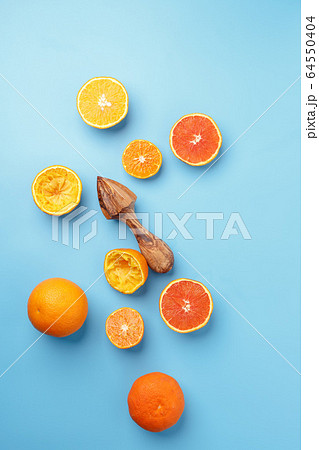 sliced lemons oranges and tangerines on a blue 64550404