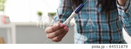 Person with pregnancy test 64551879