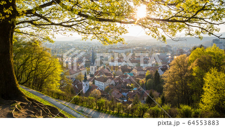 Panoramic view of Ljubljana, capital of Slovenia. Roooftops of Ljubljanas old medieval city center seen from Ljubljanas castle park at sunset 64553883