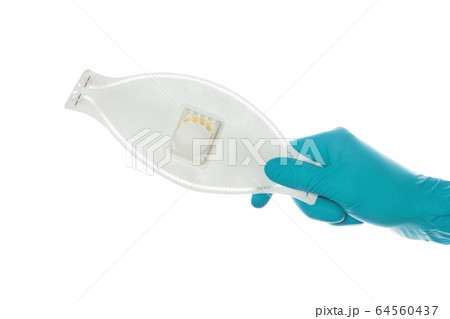 Doctor hand giving Medical mask isolated on white 64560437