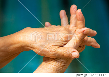Senior woman's hands washing her hands in step 2 on bokeh blue pool  background, Close up & Macro shot, Selective focus, Prevention from covid19, Bacteria, healthcare concept, 7 step wash hand Senior woman's hands washing her hands in step 2 on bokeh blue pool  background, Close up & Macro shot, Selective focus, Prevention from covid19, Bacteria, healthcare concept, 7 step wash hand 64561117