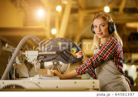 portrait of confident good-looking carpenter woman 64561397