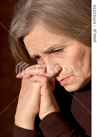 Portrait of sad senior woman at home Portrait of sad senior woman at home 64562056
