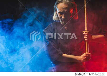portrait of kendo fighter with bokuto. traditional japanese martial art of sword fighting portrait of kendo fighter with bokuto. traditional japanese martial art of sword fighting 64562305