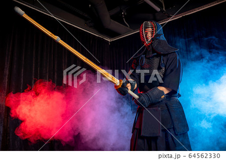 mature kendo fighter with shinai 64562330