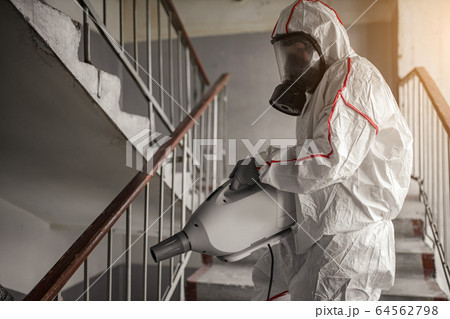 virologist in protective hazmat suit conduct disinfection 64562798