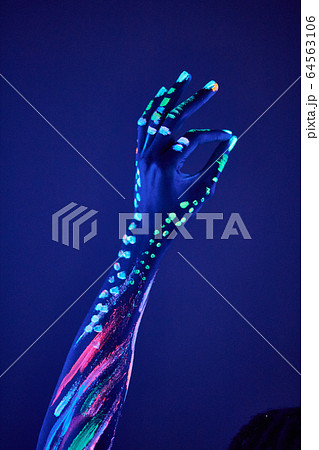 cropped photo of hands showing OK gesture 64563106