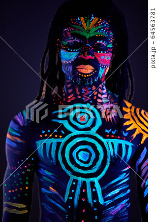 fashionable male model with fluorescent UV body art 64563781