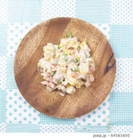 Tuna corn salad on the plate 64563850