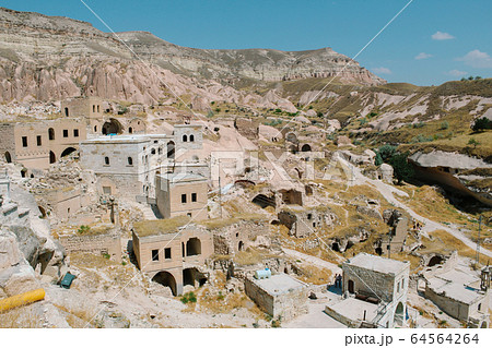 Cavusin old village, cave town in Cappadocia, Turkey 64564264
