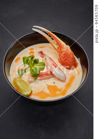 Spicy soup with crab. Thai cuisine. Spicy soup with crab. Thai cuisine. 64565709