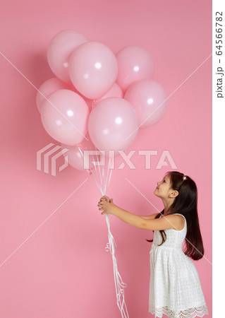 happy cute little child girl posing with pastel pink air balloons happy cute little child girl posing with pastel pink air balloons 64566782