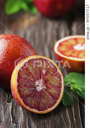 Bloody sweet oranges on the wooden table Bloody sweet oranges on the wooden table 64567517