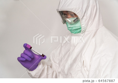 Doctors in the protective suits and masks are 64567887