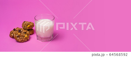 Cereal, chocolate, cookies and milk in a glass on 64568592
