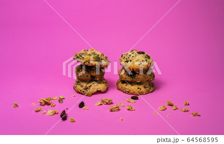 Cereal, chocolate, cookies and milk in a glass on 64568595