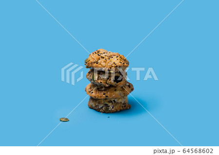 Cereal, chocolate, cookies and milk in a glass on 64568602