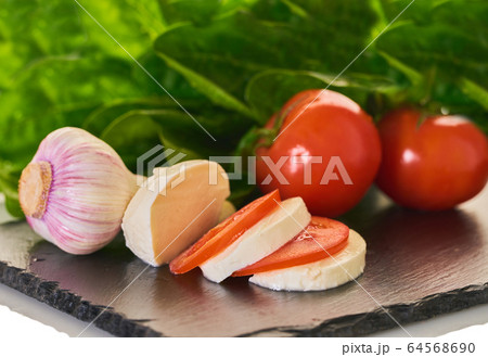 mozzarella cheese with vegetables and spinach 64568690