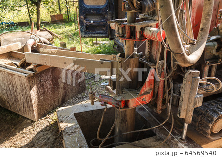 Rotary drilling rig at a construction site Rotary drilling rig at a construction site 64569540