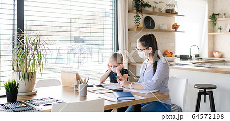 Mother and daughter learning indoors at home, Corona virus and quarantine concept. Mother and daughter learning indoors at home, Corona virus and quarantine concept. 64572198