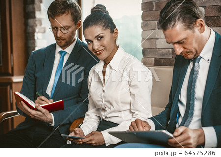 Coworkers Team Preparing Before Business Meeting Coworkers Team Preparing Before Business Meeting 64575286