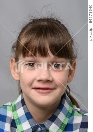Portrait of a joyfully surprised ten-year-old girl Portrait of a joyfully surprised ten-year-old girl 64575640