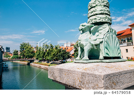 Ljubljana symbol dragon sculpture at Dragon Bridge Zmajski most in Ljubljana, Slovenia 64579058