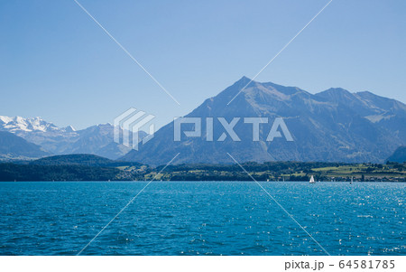 Thun lake and alps mountain in Switzerland 64581785