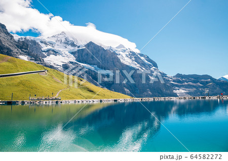 Fallbodensee lake and snowy mountain at Jungfrau region in Switzerland 64582272