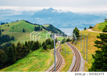 Rigi mountain and Lucerne lake and railroad in Switzerland 64582475