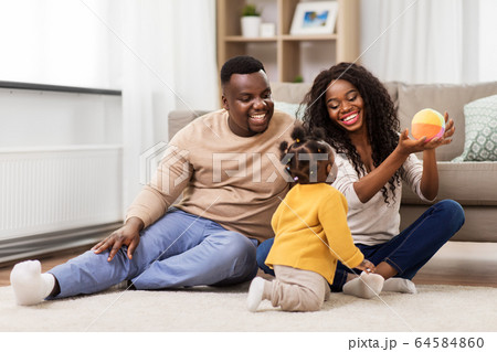 african family playing with baby daughter at home african family playing with baby daughter at home 64584860