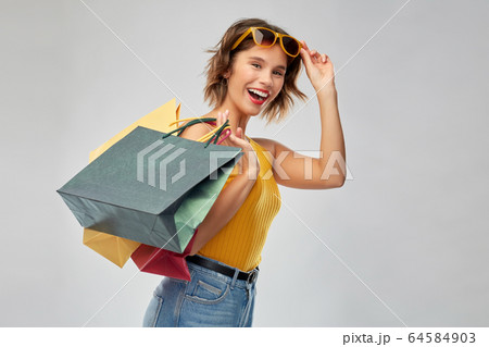 happy smiling young woman with shopping bags 64584903