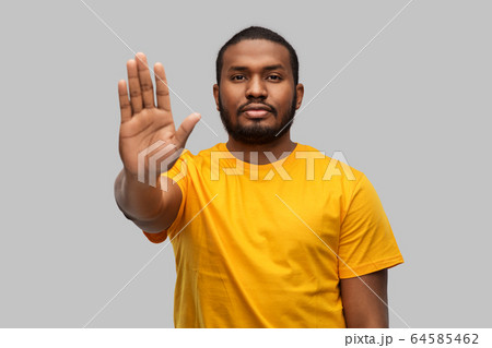 african american man showing stop gesture african american man showing stop gesture 64585462