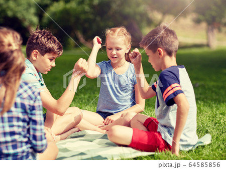 happy kids playing rock-paper-scissors game 64585856
