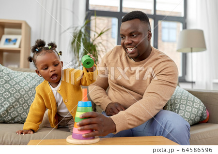 african family playing with baby daughter at home african family playing with baby daughter at home 64586596