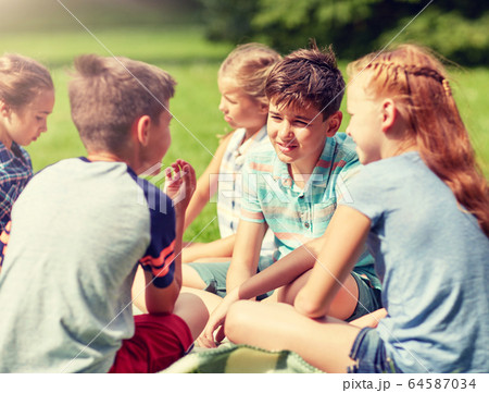 group of happy kids or friends outdoors group of happy kids or friends outdoors 64587034