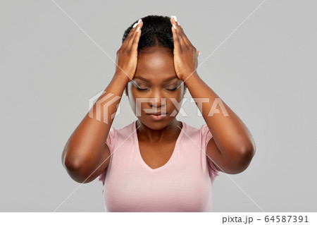 african american woman suffering from headache 64587391
