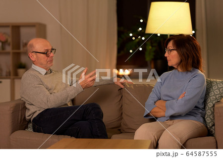 unhappy senior couple arguing at home 64587555